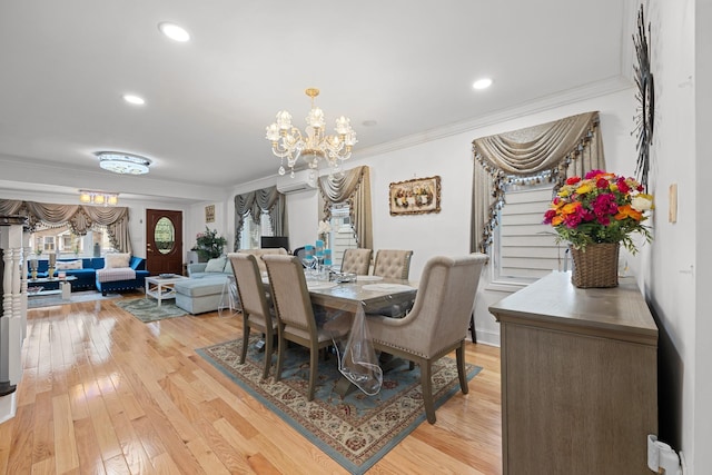 dining area with crown molding, an inviting chandelier, a wall mounted air conditioner, and stairs