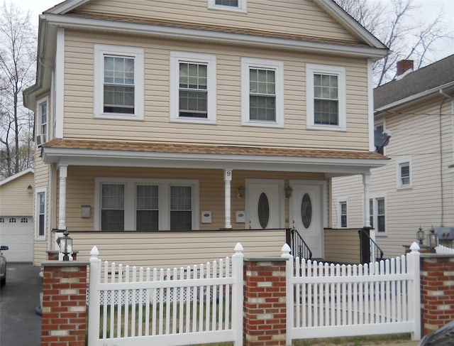 9 Lawrence Rd, Poughkeepsie, NY 12601 - view of front of property featuring a porch, fence, and a garage