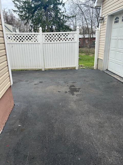 9 Lawrence Rd, Poughkeepsie, NY 12601 - exterior space featuring fence and a garage