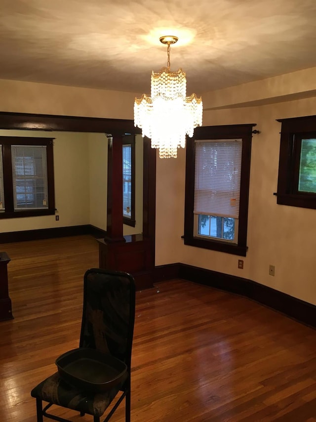 9 Lawrence Rd, Poughkeepsie, NY 12601 - interior space with baseboards, a chandelier, and wood finished floors