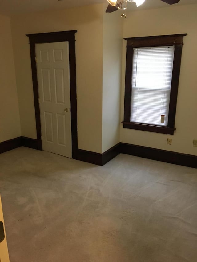 9 Lawrence Rd, Poughkeepsie, NY 12601 - spare room featuring baseboards, a ceiling fan, and light colored carpet