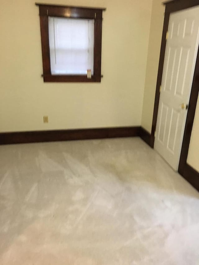 9 Lawrence Rd, Poughkeepsie, NY 12601 - spare room featuring baseboards and carpet flooring