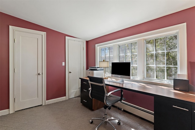 office space with baseboards, a wealth of natural light, carpet, and vaulted ceiling