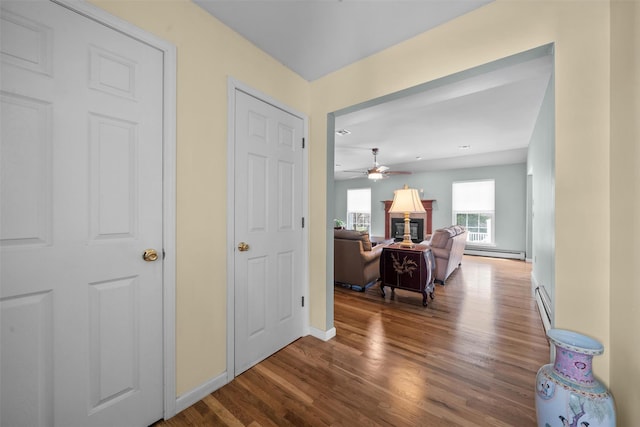 7 Center Cir, Florida, NY 10921 - hallway with baseboard heating, baseboards, and wood finished floors
