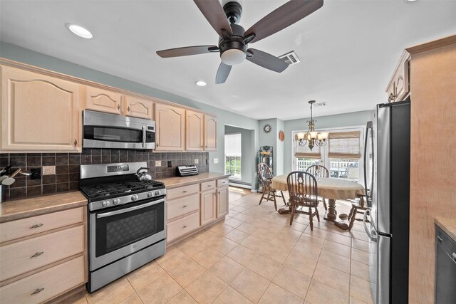 7 Center Cir, Florida, NY 10921 - kitchen with tasteful backsplash, a healthy amount of sunlight, appliances with stainless steel finishes, and light brown cabinets