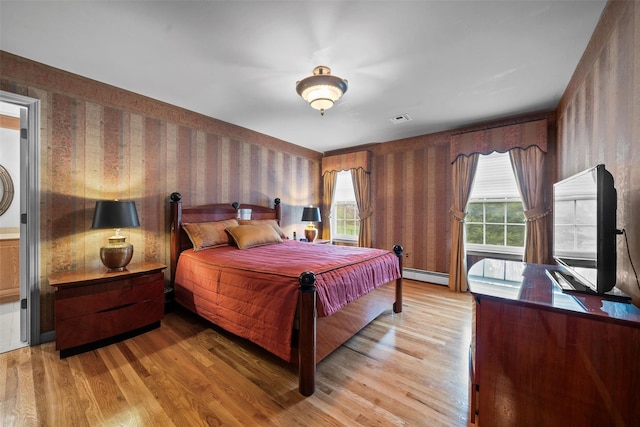 7 Center Cir, Florida, NY 10921 - bedroom featuring light wood finished floors, baseboard heating, visible vents, and multiple windows