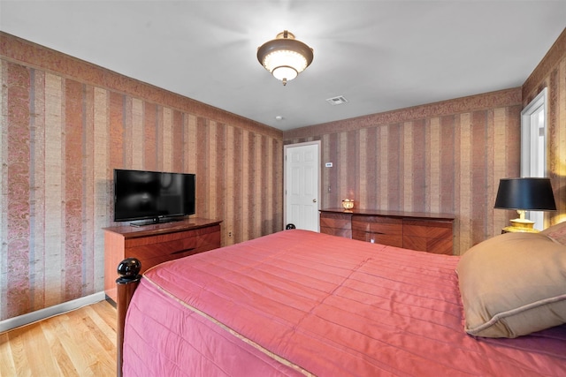 7 Center Cir, Florida, NY 10921 - bedroom featuring wallpapered walls, wood finished floors, visible vents, and baseboards
