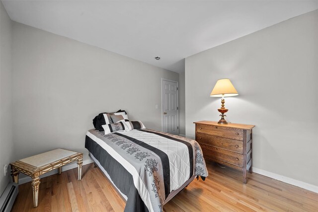 7 Center Cir, Florida, NY 10921 - bedroom featuring a baseboard radiator, baseboards, and wood finished floors