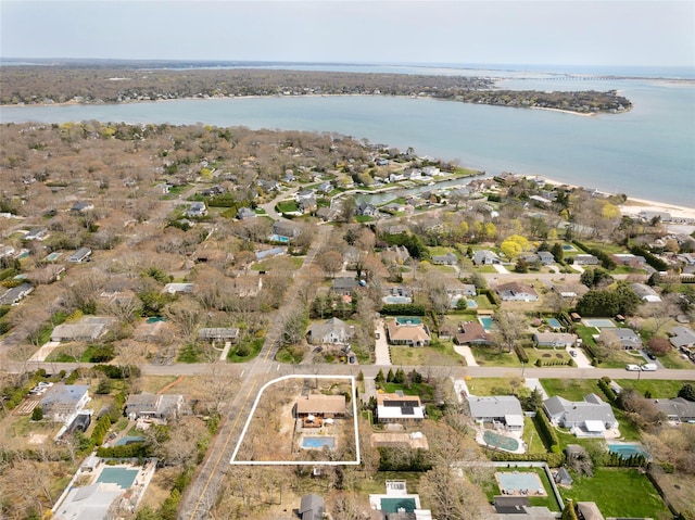 birds eye view of property with a residential view and a water view