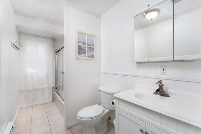 bathroom featuring tile patterned floors, vanity, toilet, and shower / bath combination with glass door