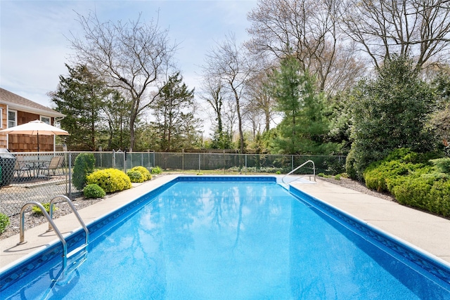 view of swimming pool with fence and a fenced in pool