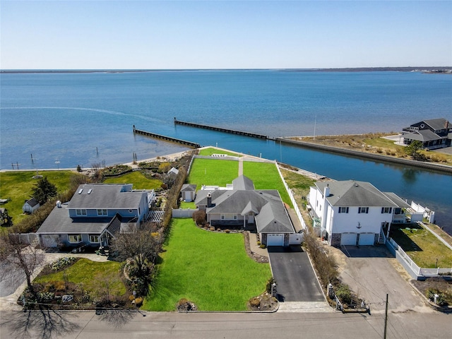 bird's eye view with a water view and a residential view