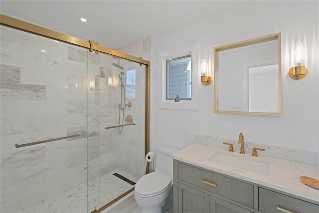 full bathroom with toilet, a marble finish shower, and vanity
