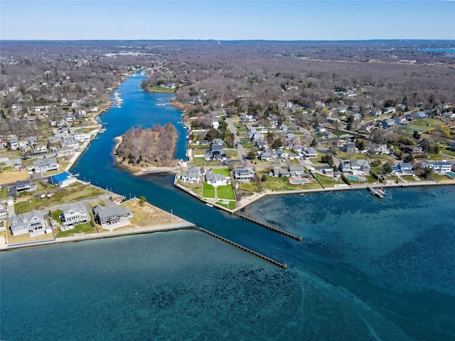 drone / aerial view featuring a water view and a residential view