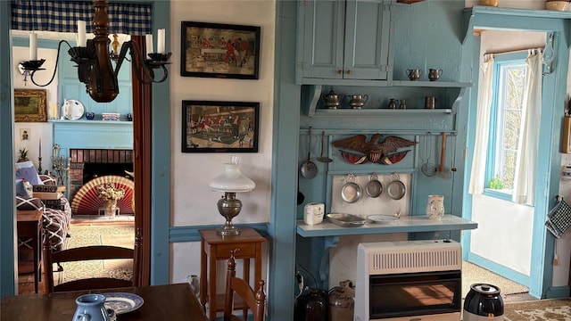 room details featuring a fireplace and heating unit