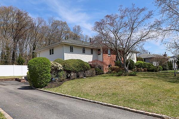 80 Lauren Ave, Dix Hills, NY 11746 - view of home's exterior with brick siding
