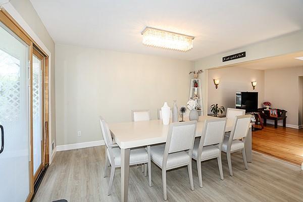80 Lauren Ave, Dix Hills, NY 11746 - dining area with light wood-type flooring and baseboards