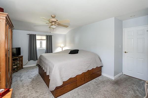 80 Lauren Ave, Dix Hills, NY 11746 - carpeted bedroom with baseboards and a ceiling fan