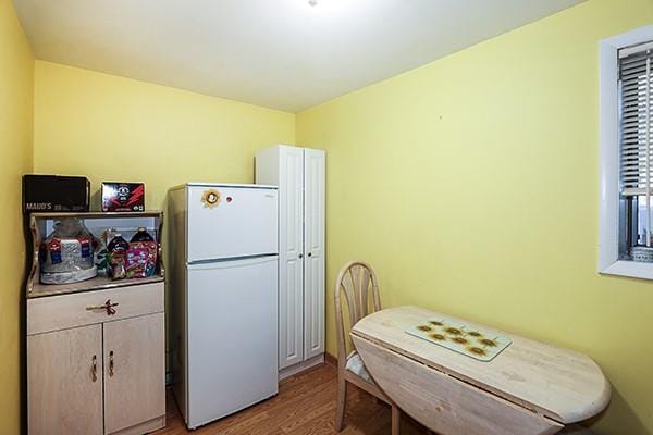80 Lauren Ave, Dix Hills, NY 11746 - kitchen featuring freestanding refrigerator and light wood-style flooring