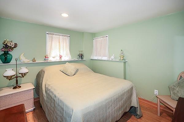 80 Lauren Ave, Dix Hills, NY 11746 - bedroom with wood finished floors and recessed lighting