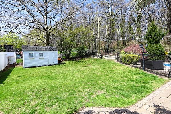 80 Lauren Ave, Dix Hills, NY 11746 - view of yard with an outdoor structure and a storage shed