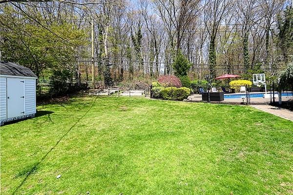80 Lauren Ave, Dix Hills, NY 11746 - view of yard featuring a shed and an outbuilding