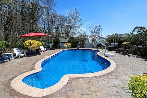 80 Lauren Ave, Dix Hills, NY 11746 - outdoor pool with a patio area and fence