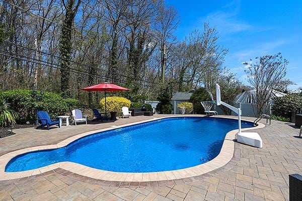 80 Lauren Ave, Dix Hills, NY 11746 - swimming pool featuring a patio area