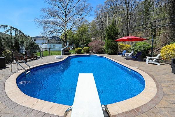 80 Lauren Ave, Dix Hills, NY 11746 - view of swimming pool featuring a diving board, a patio, and fence