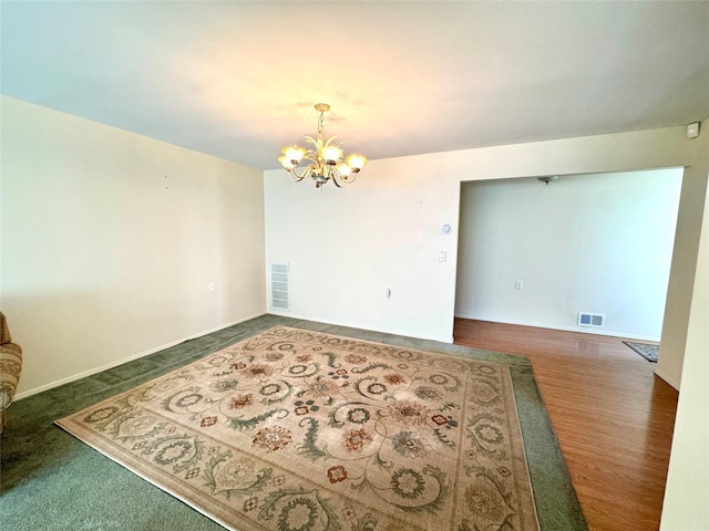 11 Theodore Dr, Coram, NY 11727 - spare room with a chandelier and baseboards