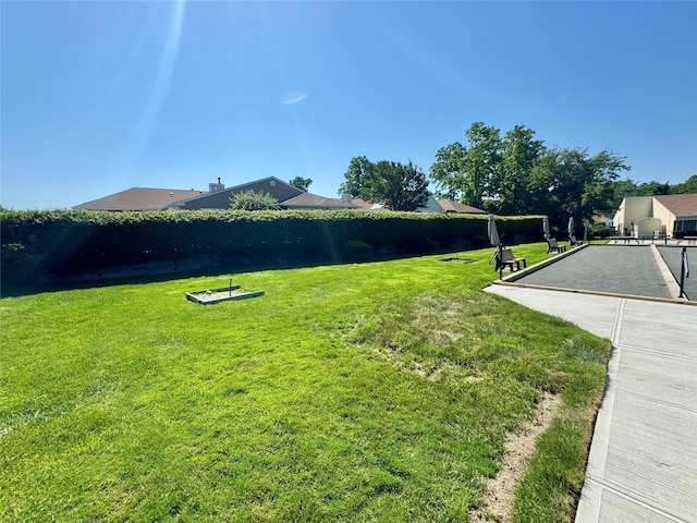 11 Theodore Dr, Coram, NY 11727 - view of grassy yard with a game area