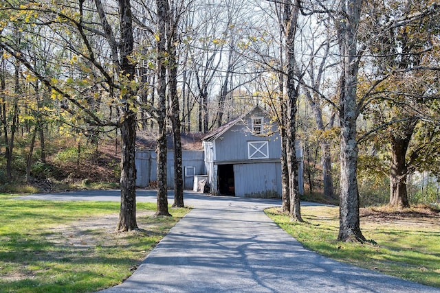 452 Hibernia Rd, Salt Point, NY 12578 - view of front of house featuring a barn, a garage, an outdoor structure, a front lawn, and driveway