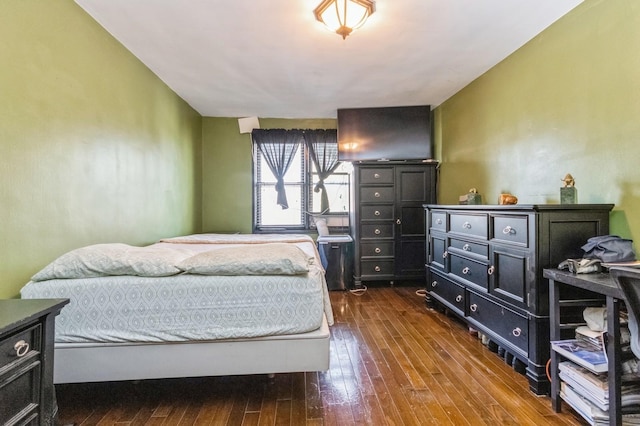 bedroom featuring dark wood-type flooring