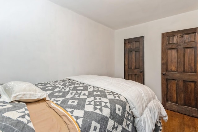 bedroom featuring wood finished floors