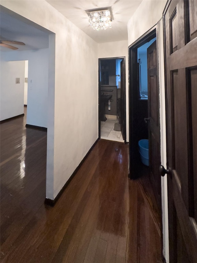 4265 Webster Ave Unit 6D, Bronx, NY 10470 - hall with dark wood-style floors and a chandelier