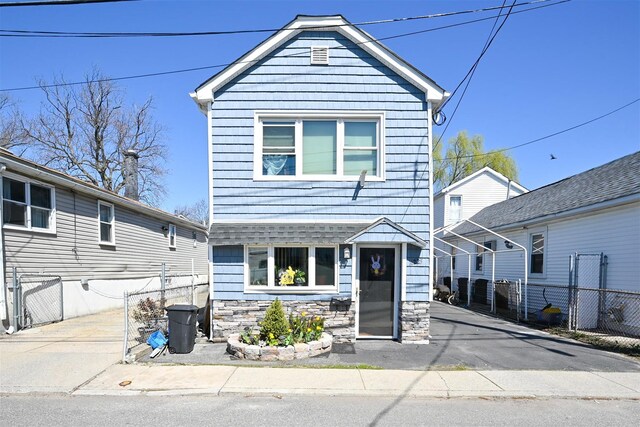 102-25 163rd Dr, Howard Beach, NY 11414 - traditional-style home with fence and stone siding