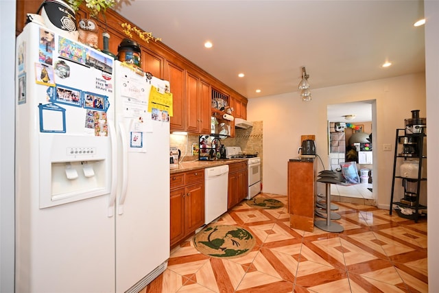 102-25 163rd Dr, Howard Beach, NY 11414 - kitchen featuring backsplash, brown cabinetry, recessed lighting, and white appliances