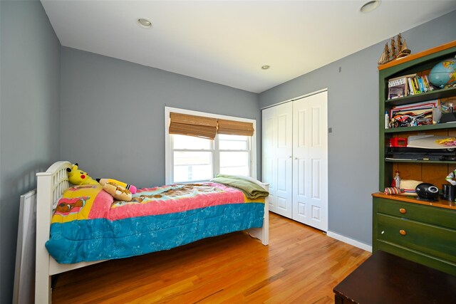 102-25 163rd Dr, Howard Beach, NY 11414 - bedroom featuring recessed lighting, a closet, baseboards, and wood finished floors
