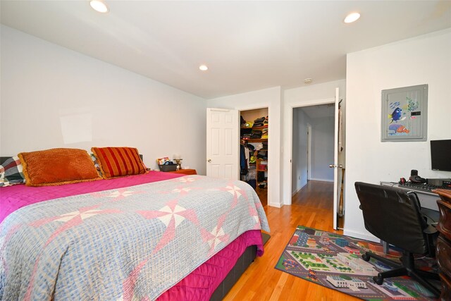 102-25 163rd Dr, Howard Beach, NY 11414 - bedroom featuring a walk in closet, recessed lighting, and wood finished floors