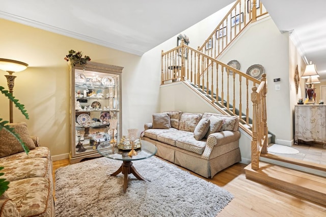 60 Southgate Cir, Massapequa Park, NY 11762 - living area with stairway, baseboards, ornamental molding, and wood finished floors