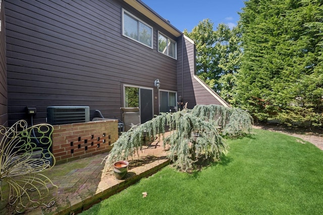 60 Southgate Cir, Massapequa Park, NY 11762 - back of house featuring central air condition unit, a patio area, and a yard