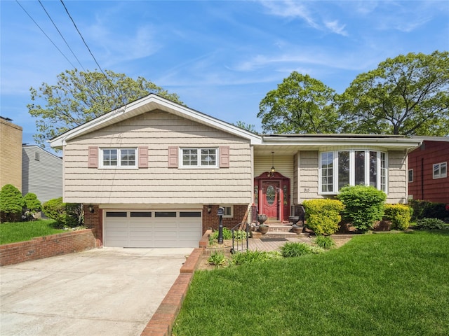 915 Derrick Adkins Ln, West Hempstead, NY 11552 - raised ranch featuring an attached garage, driveway, and a front yard