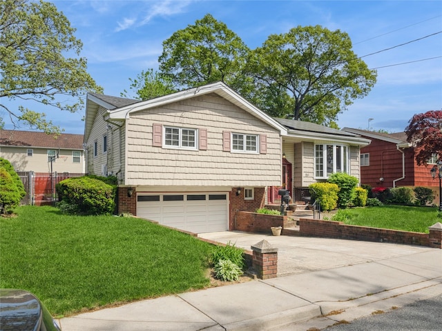 915 Derrick Adkins Ln, West Hempstead, NY 11552 - split level home featuring an attached garage and driveway