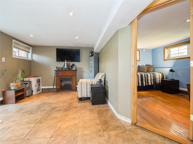 915 Derrick Adkins Ln, West Hempstead, NY 11552 - living area featuring a fireplace, baseboards, and recessed lighting