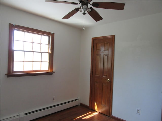 29 Beattie Rd, Washingtonville, NY 10992 - empty room with baseboards, a ceiling fan, a baseboard heating unit, and dark wood finished floors