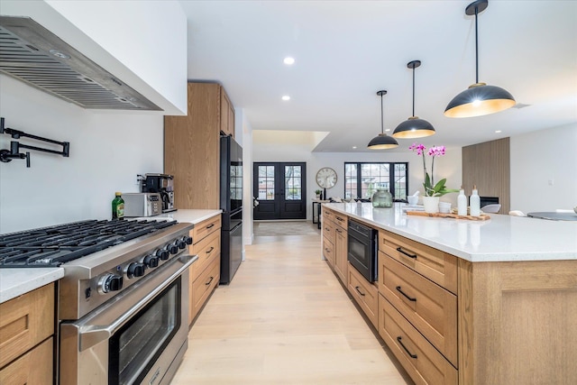 64 Jane Ct, Westbury, NY 11590 - kitchen with freestanding refrigerator, recessed lighting, light countertops, high end stainless steel range oven, and built in microwave