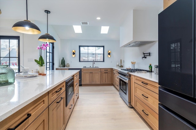 64 Jane Ct, Westbury, NY 11590 - kitchen featuring custom exhaust hood, fridge, visible vents, stainless steel range, and a sink