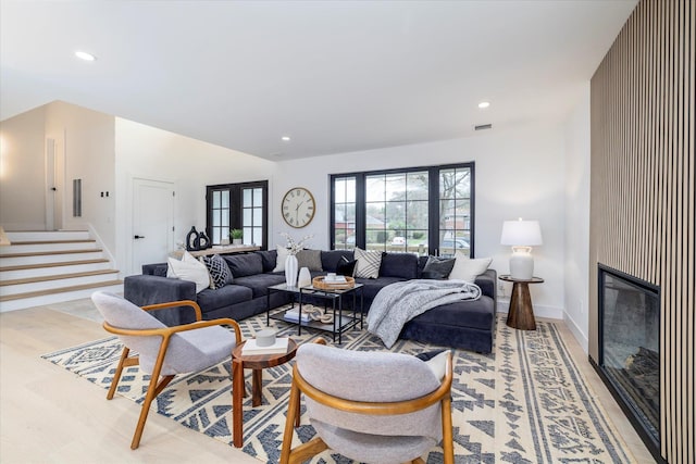 64 Jane Ct, Westbury, NY 11590 - living room featuring a fireplace, visible vents, recessed lighting, stairway, and baseboards
