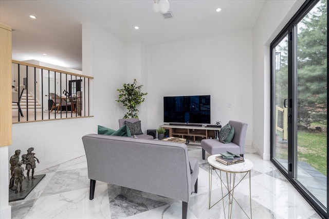 64 Jane Ct, Westbury, NY 11590 - living area with visible vents, a wealth of natural light, recessed lighting, and marble finish floor