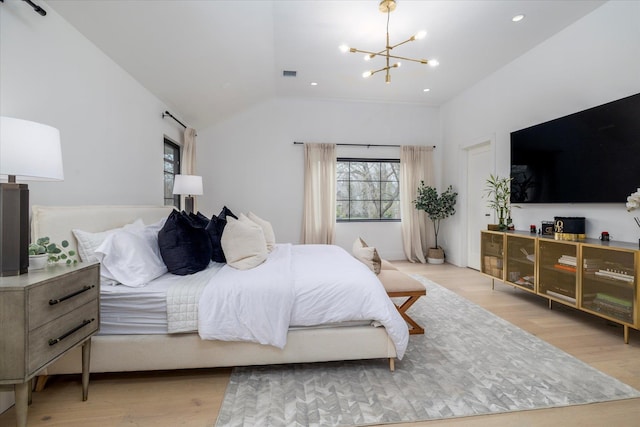 64 Jane Ct, Westbury, NY 11590 - bedroom featuring multiple windows, vaulted ceiling, a notable chandelier, and wood finished floors